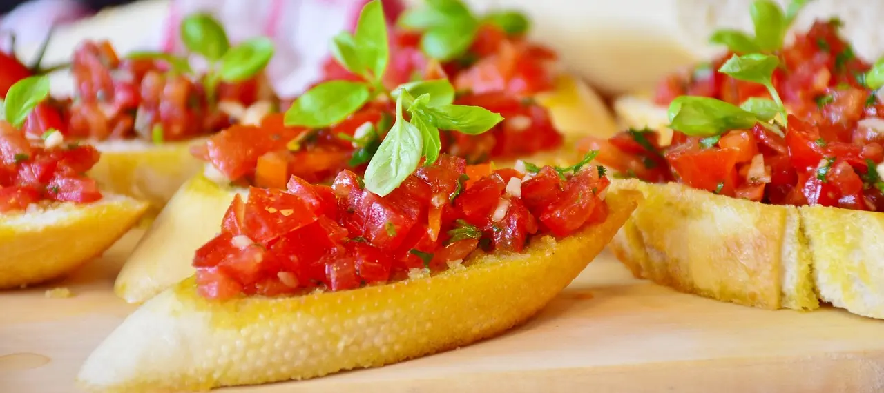 a delicious dish of balsamic bruchetta with tomatos and basil